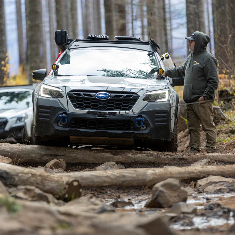 Image showing the Subaru Outback getting pulled out using the rallitek hidden winch bumper attached to the blue d rings