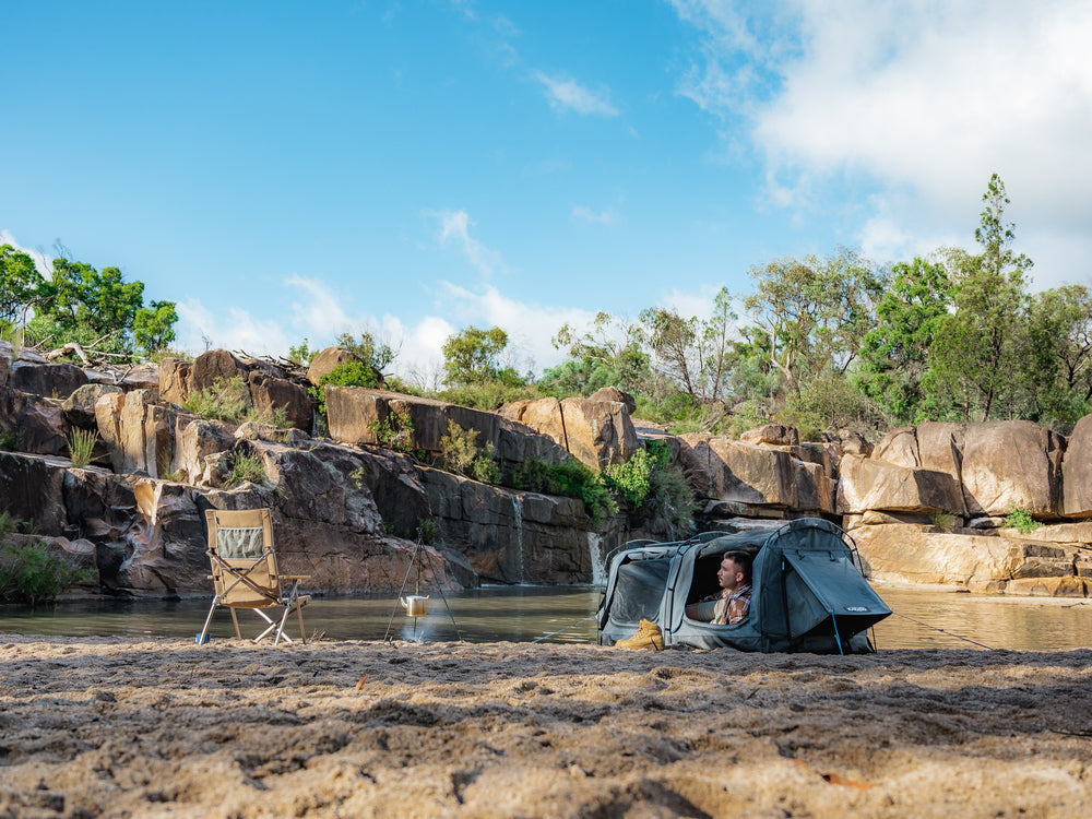 Person Laying Inside The Kakadu Sundowner Swag Tent