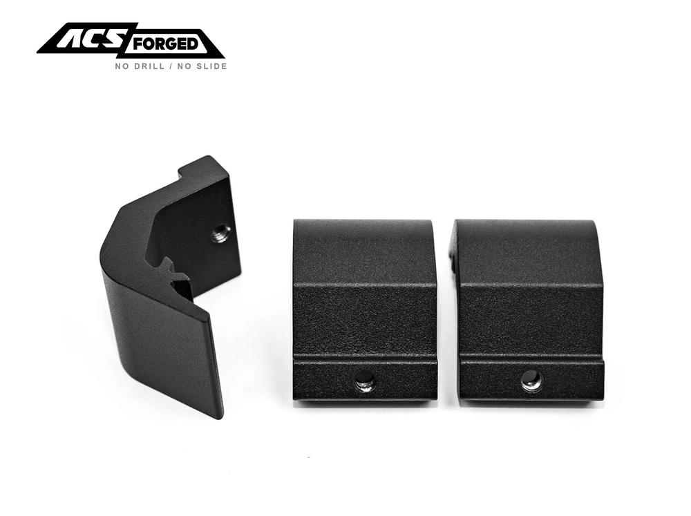 Three individual black powder-coated bed rack mounting clamps shown from different angles against a white background to display their custom-engineered profile.