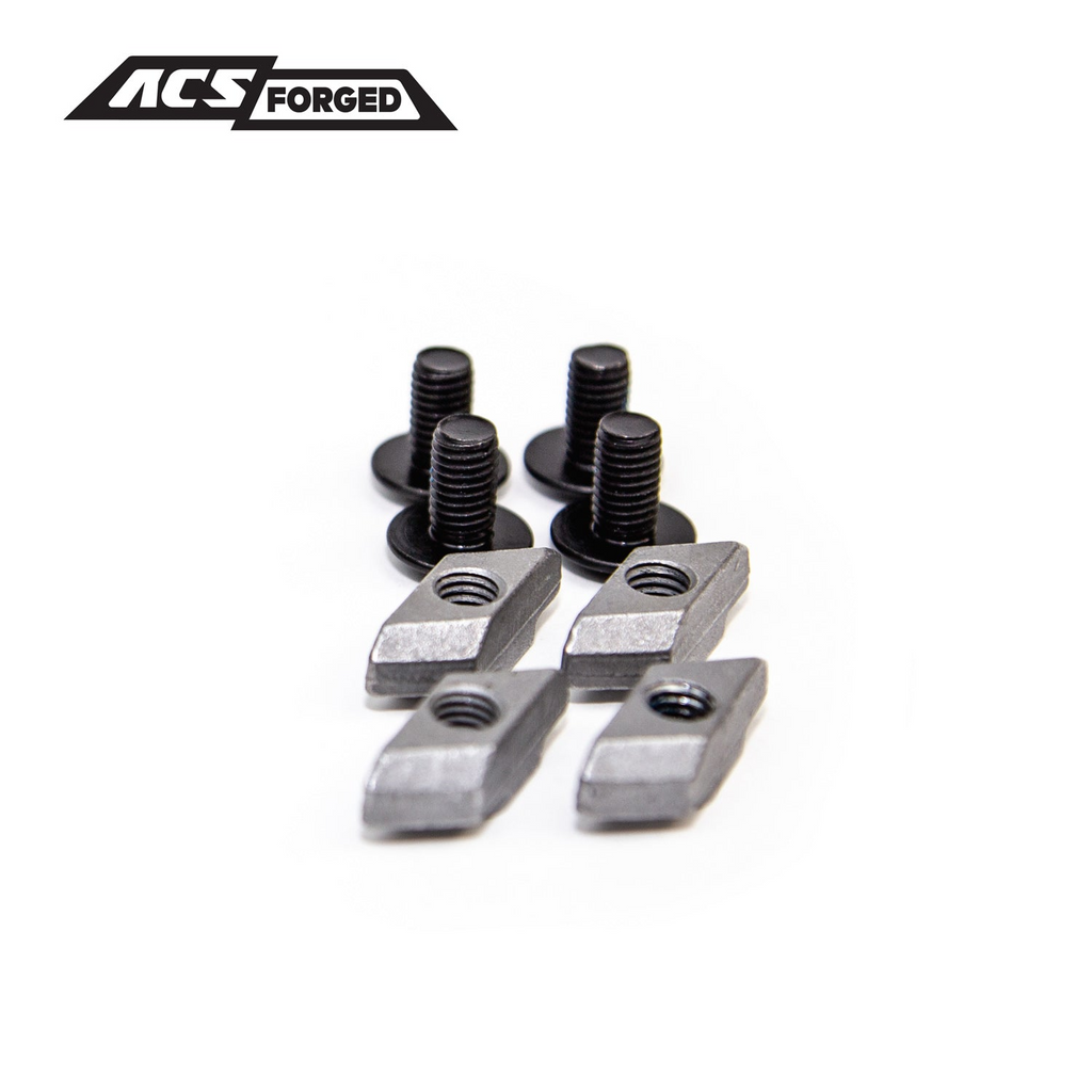 Close-up of four black mounting bolts and four silver threaded T-nuts used for securing accessories to the ACS Forged rack system.