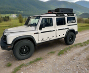 leitner 3/4 roof rack for the ineos grenadier side view with mountains in the back