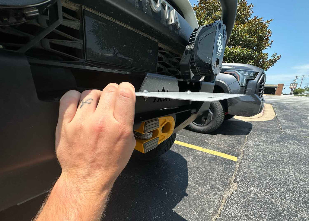 Using the flip up license plate bracket for Backwoods Adventure Mods Hi-Lite Series high clearance off road front bumpers with hawse fairleads installed