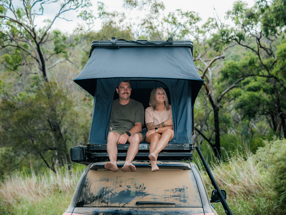 2 People Sitting Inside The Kakadu Canning Roof Top Tent