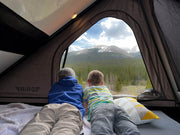 People Laying Inside The GAIA Campers Jeep Gladiator Camper
