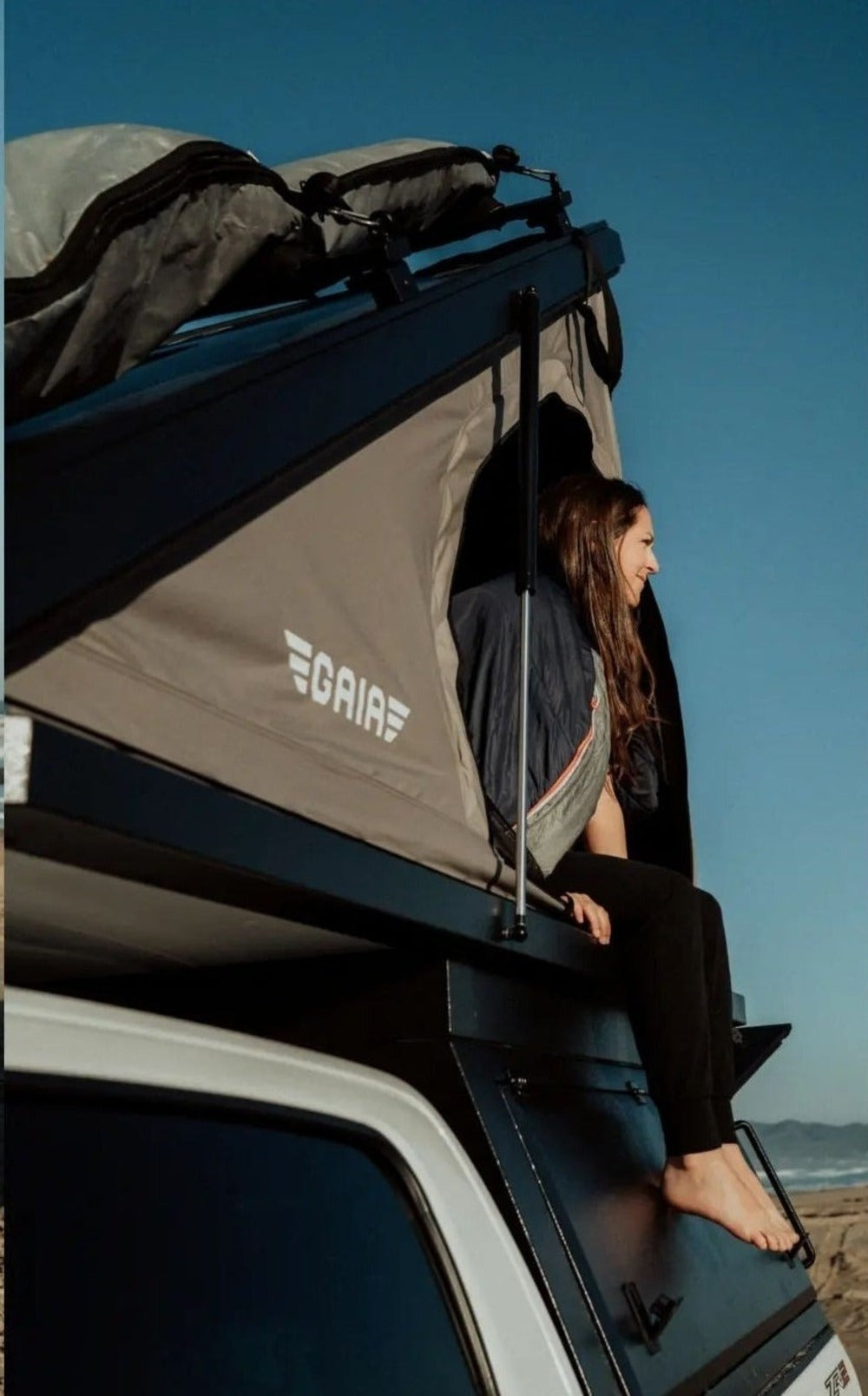 Person Sitting Inside The GAIA Campers Colorado/Canyon Camper