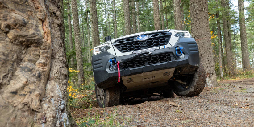 Image displaying the rallitek hidden winch bumper equipped with a winch in action