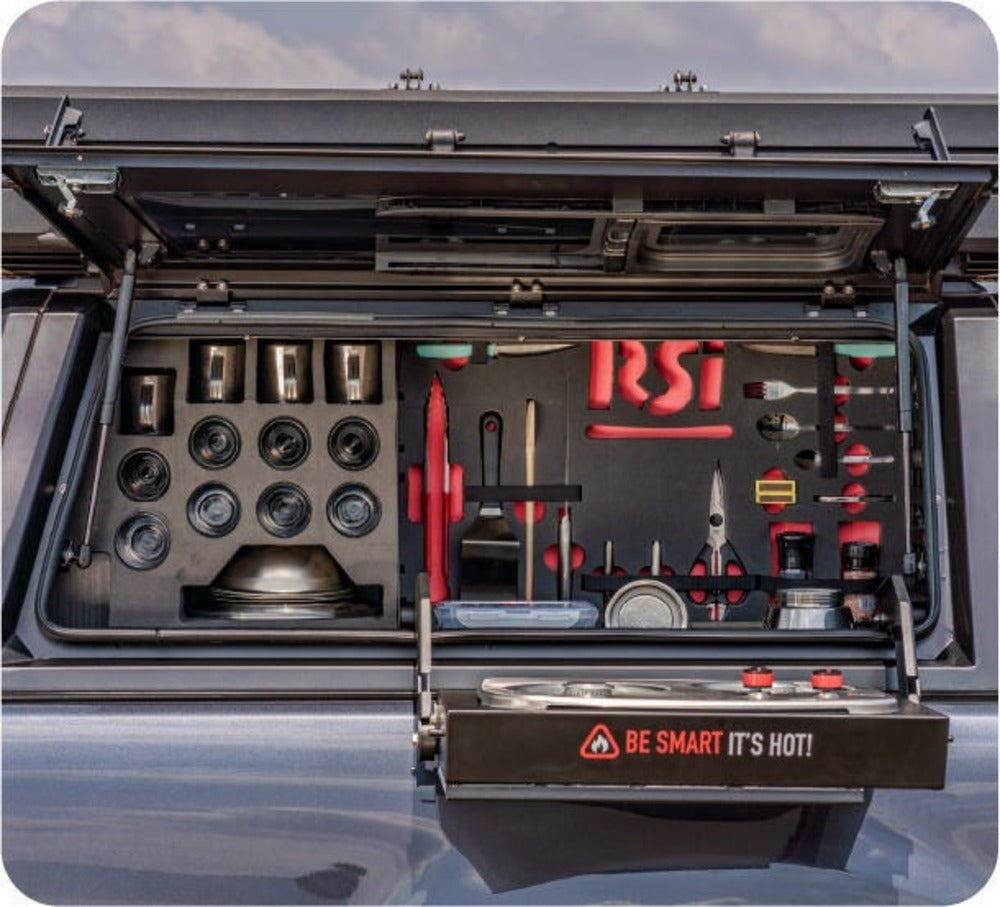 Front View Of The RSI Smartcap Camp Kitchen Filled With Utensils And Cookware