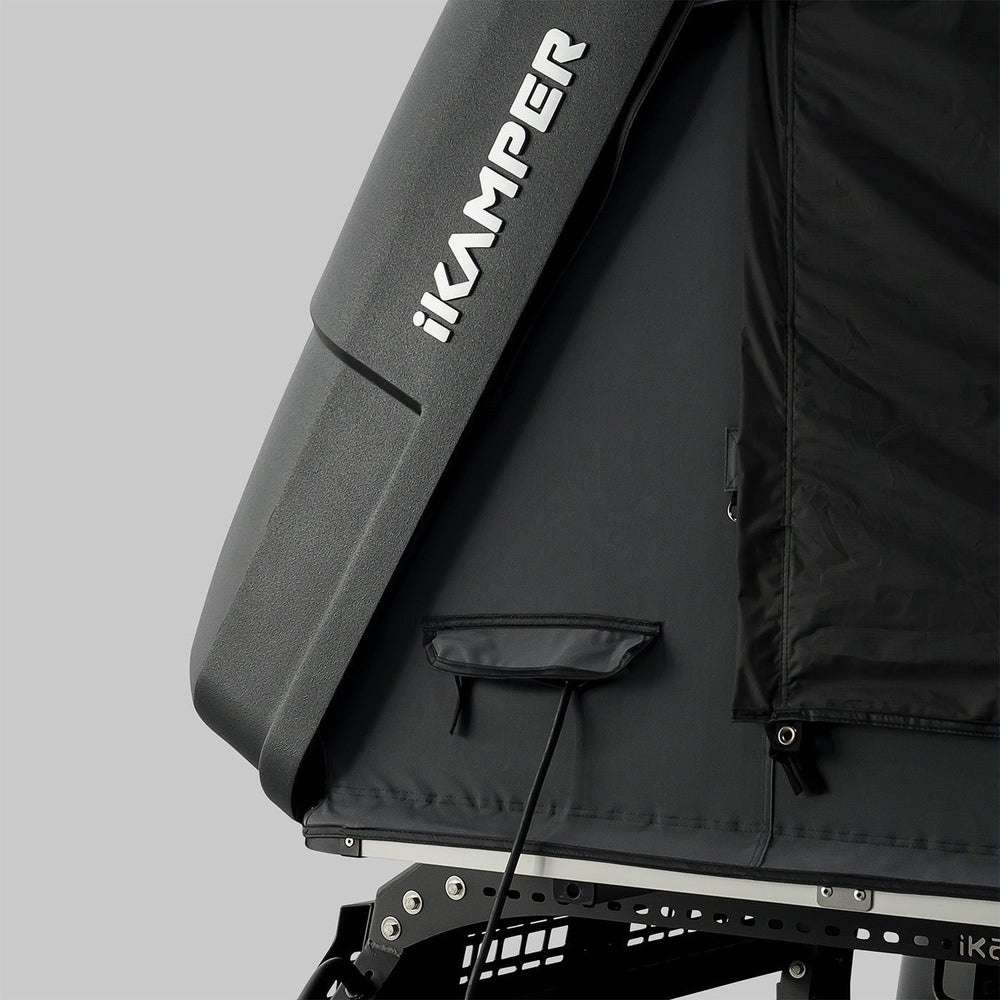 iKamper Skycamp 4.0 Duo rooftop tent mounted on SUV at campsite