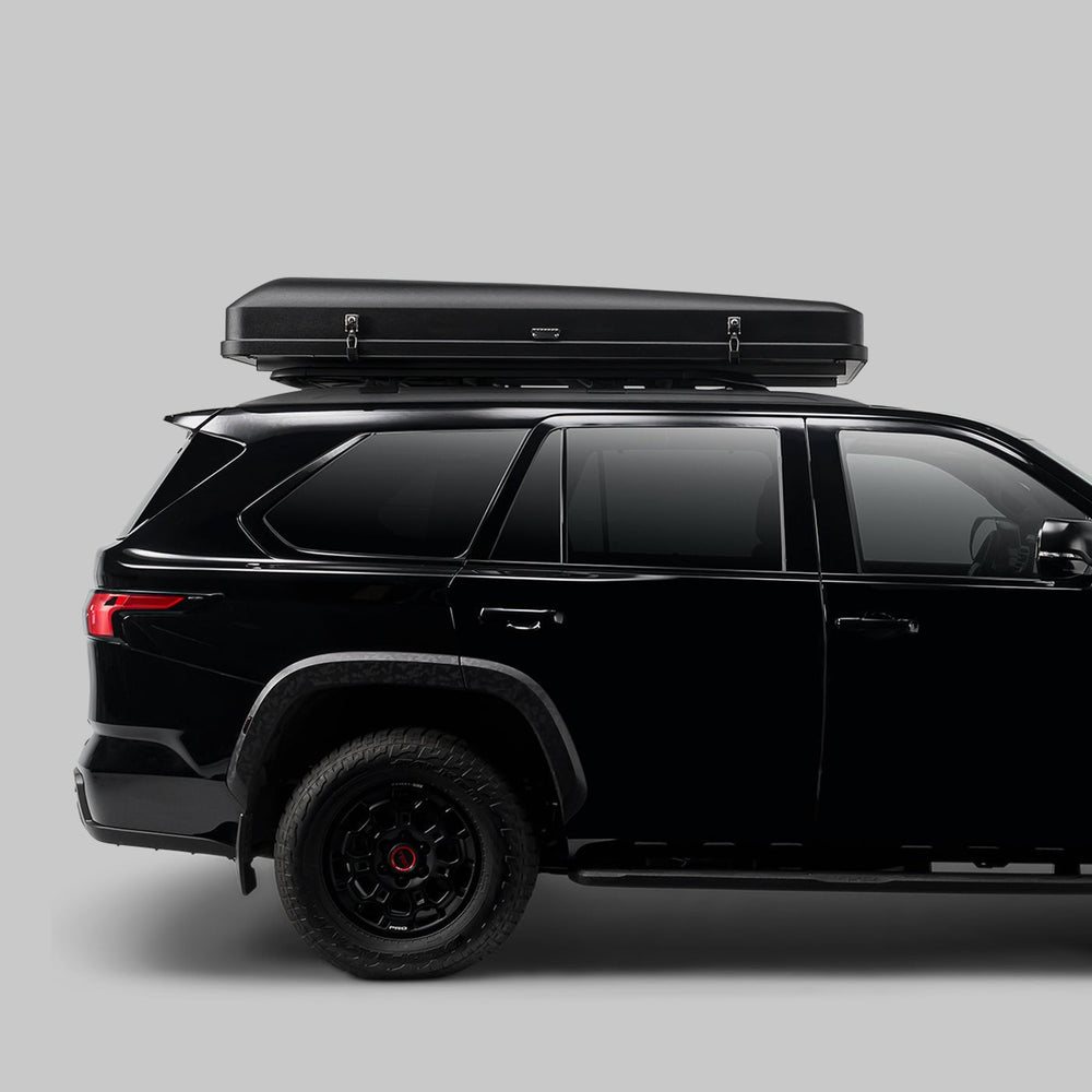 Skycamp 4.0 Quad hardshell rooftop tent at sunset campsite
