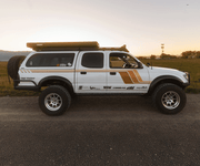 Prinsu Pro 1st Gen Tacoma cab rack rear angle showing wind deflector