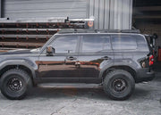 Black Toyota Land Cruiser 250 with Backwoods DRIFTR roof rack installed