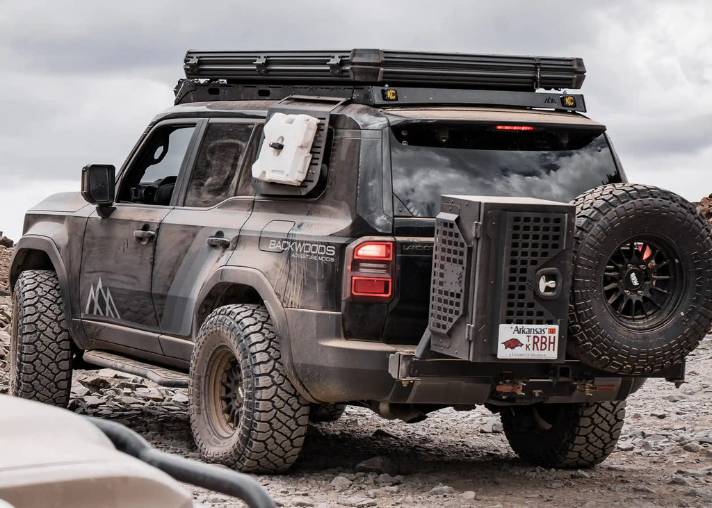 Toyota Land Cruiser 250 driving off road with DRIFTR roof rack installed