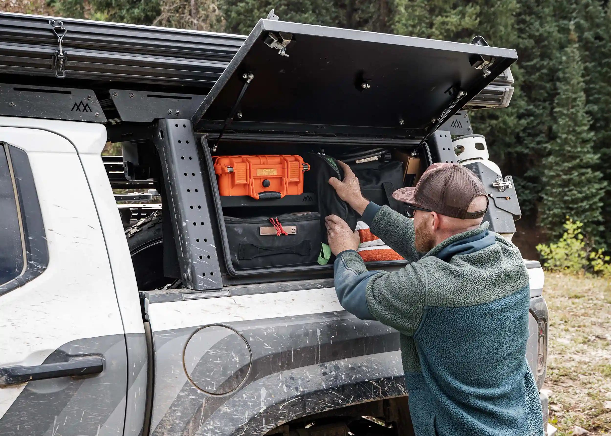 Backwoods Adventure Mods aluminum overland bed rack storage box mounted on Toyota Tacoma bed rack