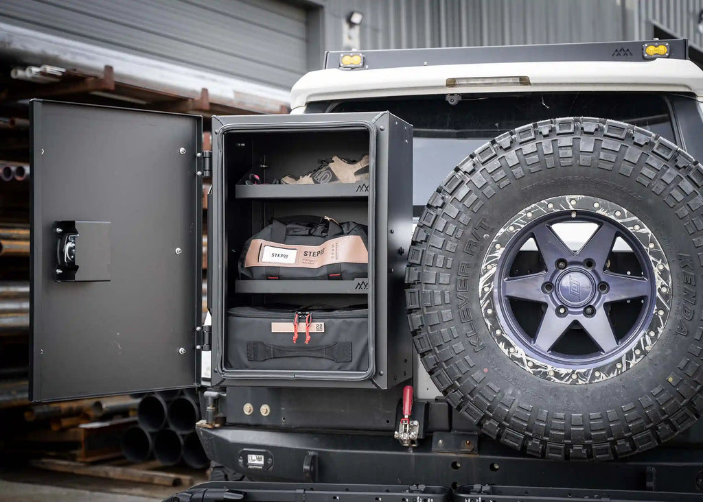 Backwoods Universal Overland Storage Box open showing organized gear inside