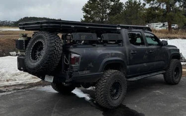 Image showing the rear side of the colorado with the diamondback truss bed rack mounted