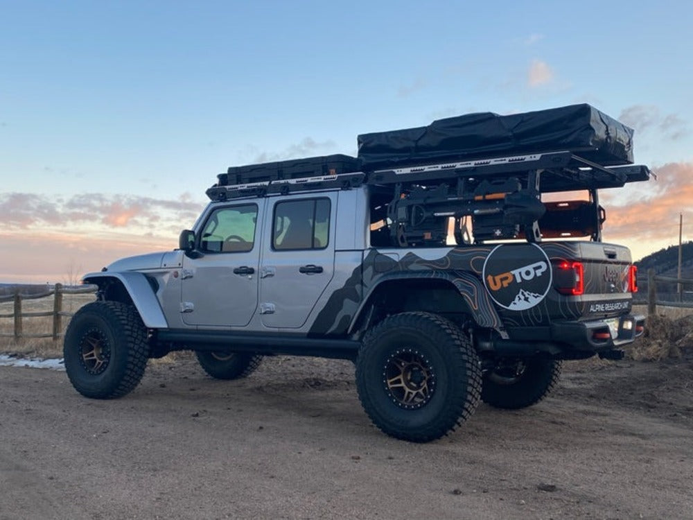 Side View Of The Installed upTOP Overland TRUSS Jeep Gladiator Bed Rack With A Roof Top Tent On Top Of It