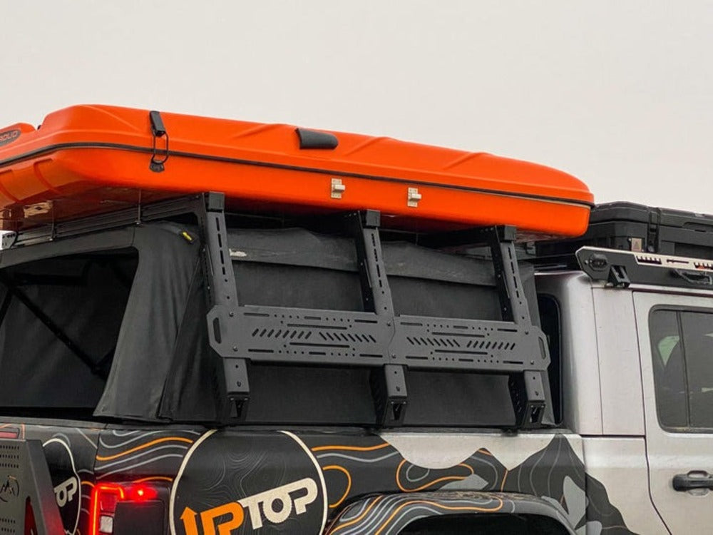 Side View Of The upTOP Overland TRUSS Soft Top Compatible Bed Rack Mounted On A Jeep