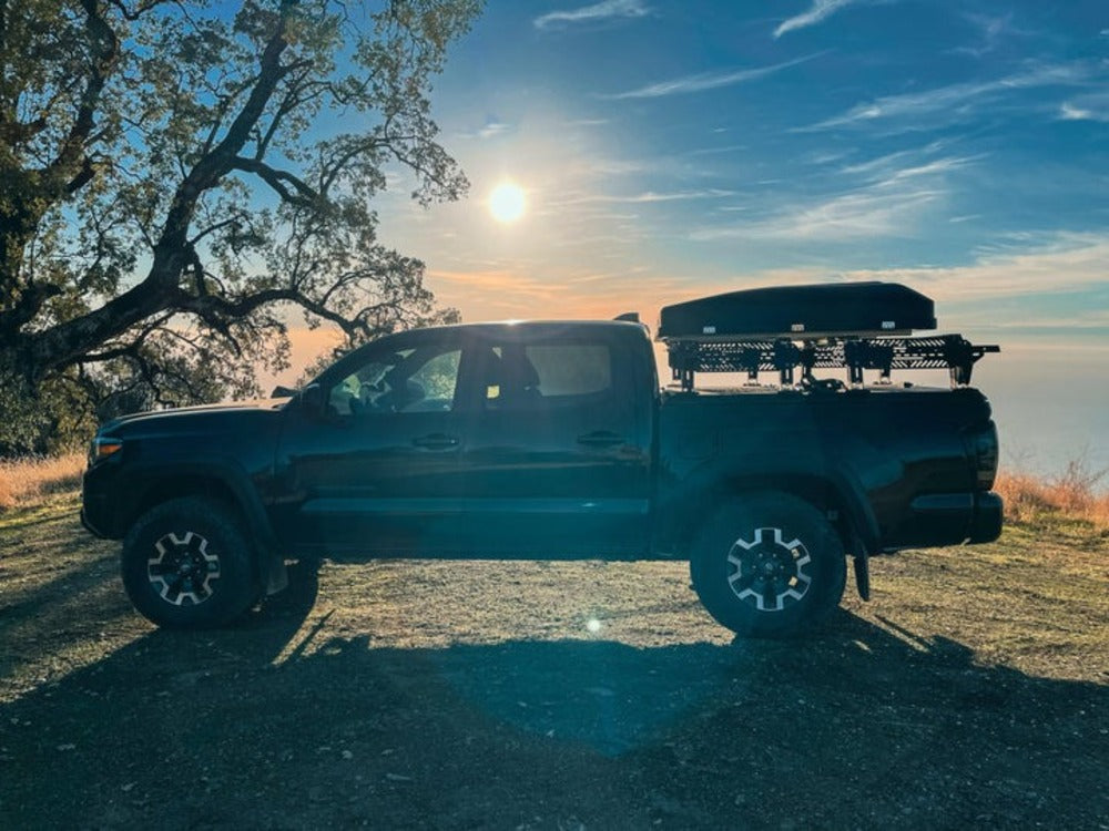 Side View Of A Roof Top Tent Mounted On A upTOP Overland Tacoma Diamondback TRUSS Bed Rack