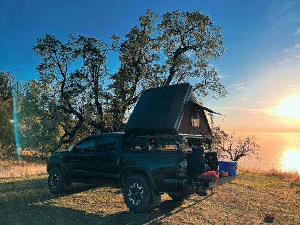 upTOP Overland Tacoma Diamondback TRUSS Bed Rack With A Mounted Roof Top Tent