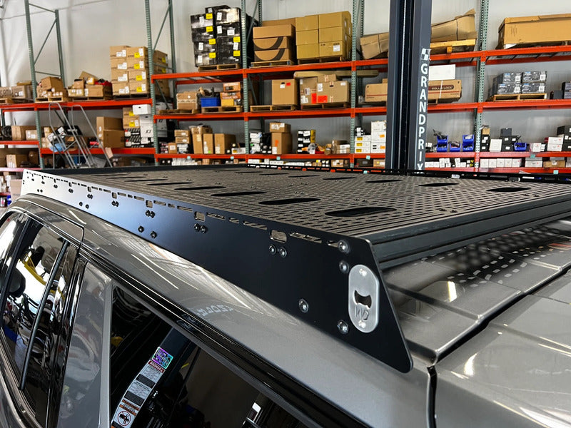 Side Close Up View Of The Westcott Designs Yukon & Tahoe Roof Rack With A Bottle Opener