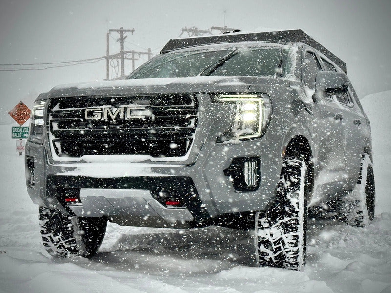 Westcott Designs Yukon & Tahoe Roof Rack Mounted On A GMC In The Snow