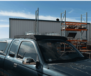 Original Prinsu Tacoma XtraCab rack rear angle showing aerodynamic wind deflector