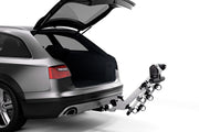 Helium Pro 3 - Hitch Bike Rack - by Thule with rear trunk of vehicle open 