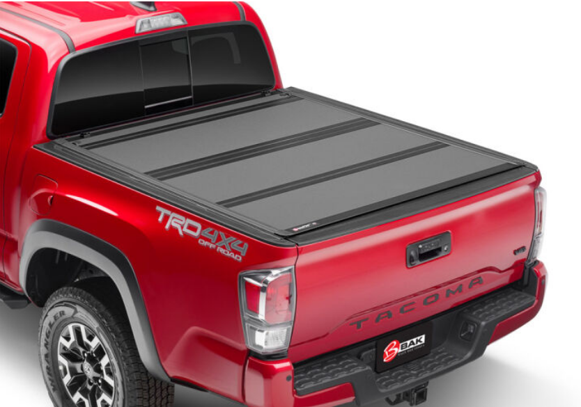 Left View of BAK Industries BAKFlip MX4 Truck Bed Cover W/ Deck Rail System