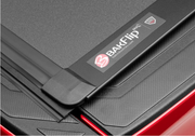 Logo of BAK Industries BAKFlip MX4 Truck Bed Cover W/ Deck Rail System