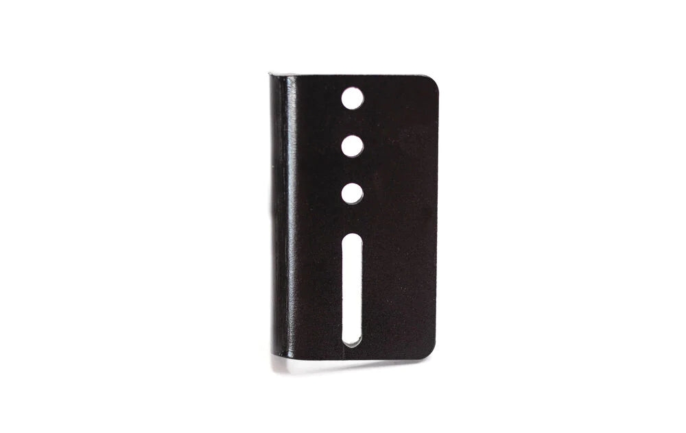 has a 1 inch of in-out adjustment and vertical mounting holes