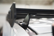 With a  9 extrusion crossbars or by strapping it directly to the side plates.
