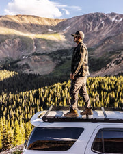 Man Standing On A roof Rack by Prinsu