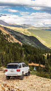 Toyota With a Prinsu Roof Rack Standing On A Side Of A Mountain