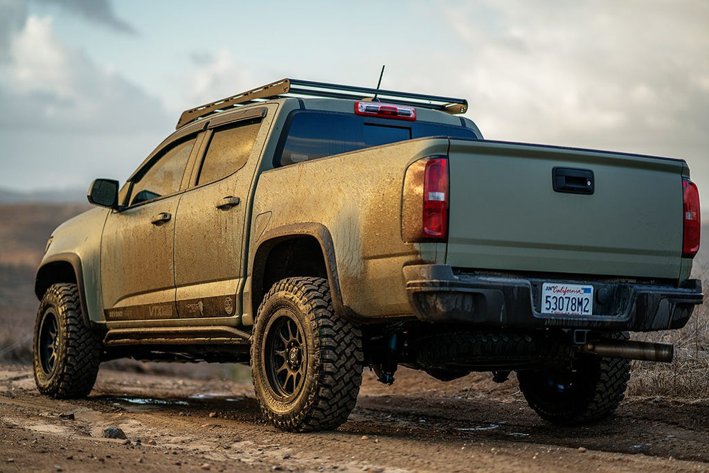 Prinsu Roof Rack on Chevy Colorado color green rear view in wasteland