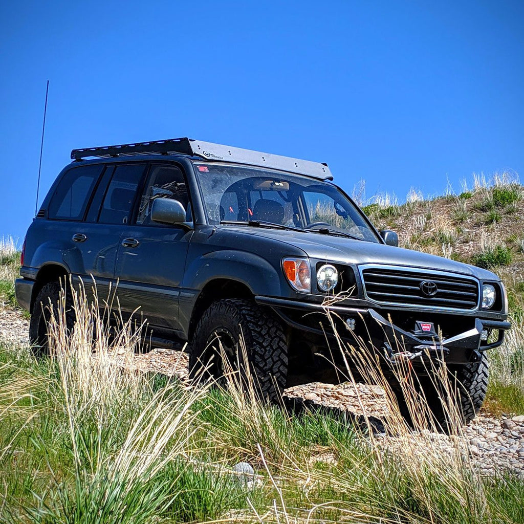 Prinsu Roof Rack on Land Cruiser Series 100 in trail with grass