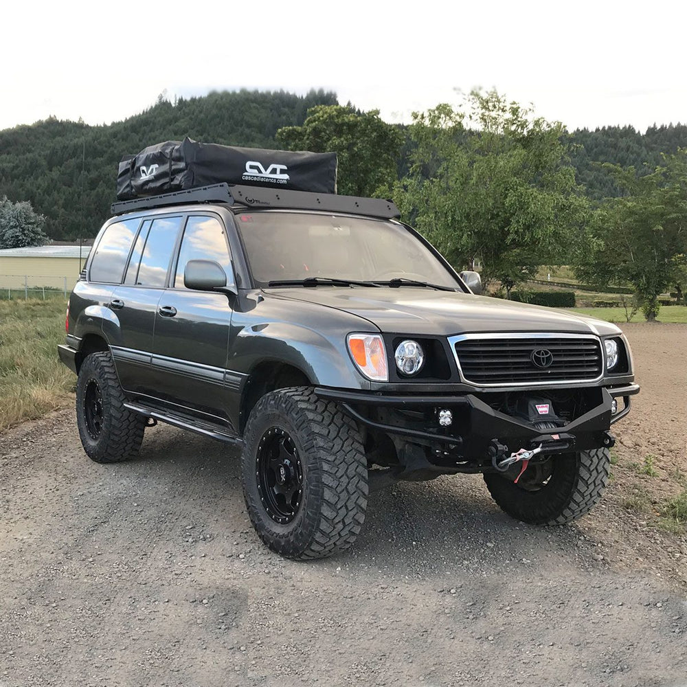 Prinsu Roof Rack on Land Cruiser Series 100 with Roof Top Tent in front of mountain