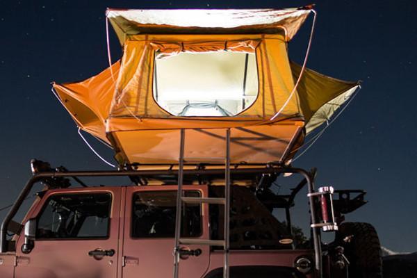 Smittybilt Overlander Roof Top Tent With The Interior LED On 