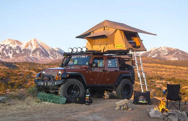 Smittybilt overlander roof top tent deployed on a jeep