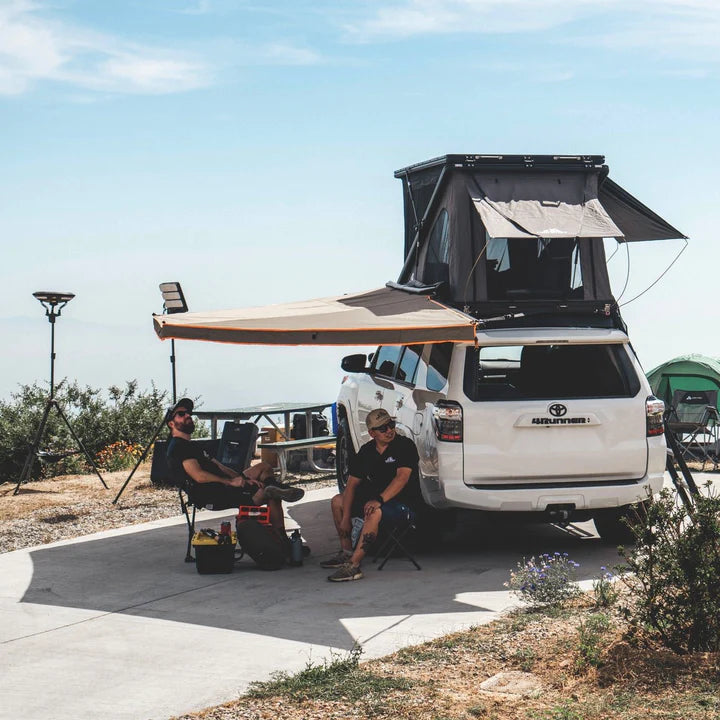 Tuff Stuff 180º Degree XL Awning With Campers Relaxing Underneath