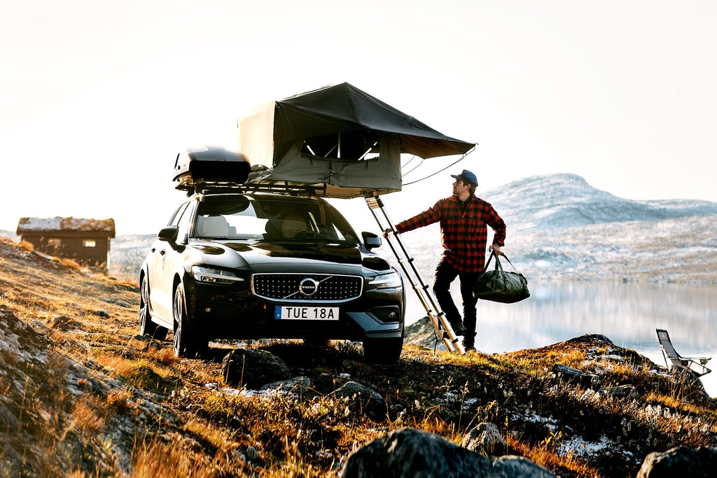 Volvo With A Deployed Thule 2-Person Roof Top Tent 