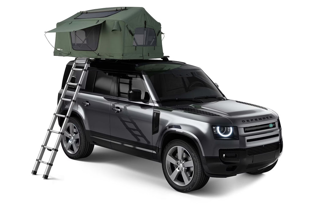 Land Rover Defender With A Thule 2-Person Roof Top Tent On its Roof Rack Without The Tent Canopy