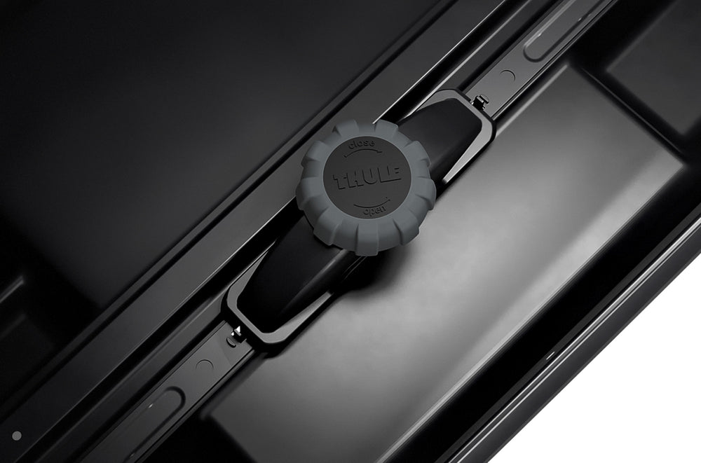 Thule Motion XT L On Top of Car Black PowerClick Close Up
