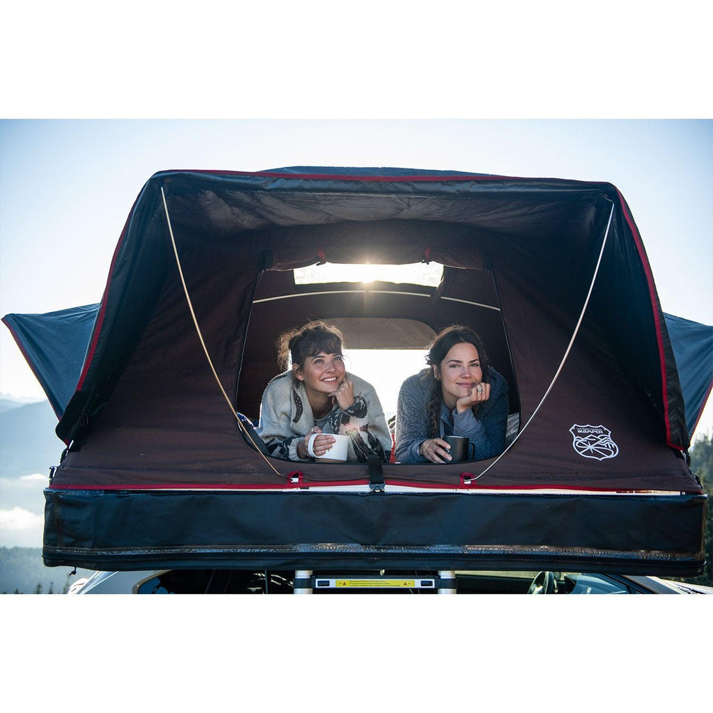 people inside the iKamper X-Cover Softshell Roof Top Tent