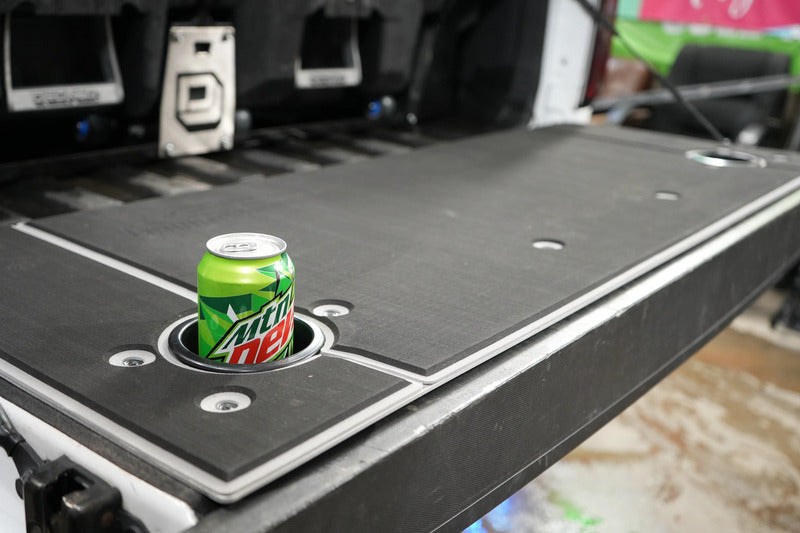 BillieBars Colorado & Canyon Tailgate Cover With A Mountain Dew Can Inside The Cup Holders