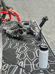BillieBars Custom Tailgate Cover With A Bottle Inside The Cup Holders And Shoes On The Tailgate Cover