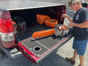 BillieBars Tundra Tailgate Cover Installed With A Chainsaw Siting On Top Of It