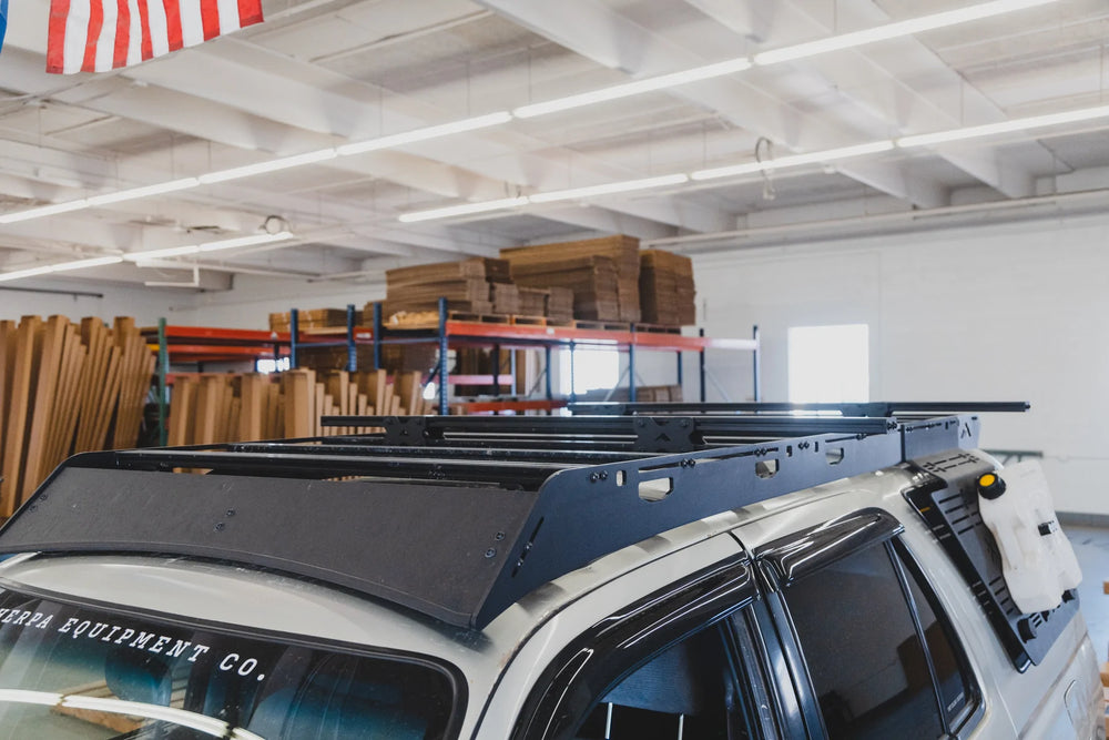Sherpa Crossbar Risers on The Top of the Vehicle