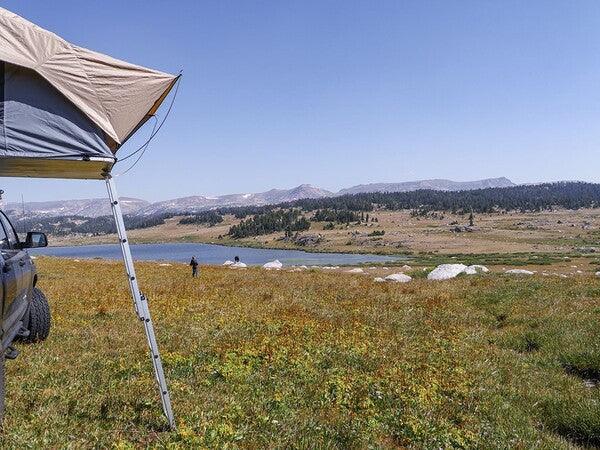 Front Runner Roof Top Tent With A Deployed Ladder On A Plains Field