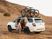 Image showing a couple mounting bikes on the slimsport roof rack