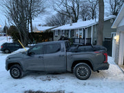 SIde View Of The Tundra With BillieBars Bed Bars With Mounted Accessory Panels